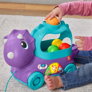 Fisher price hraj�c� dino s vyskakuj�c�mi m��ky